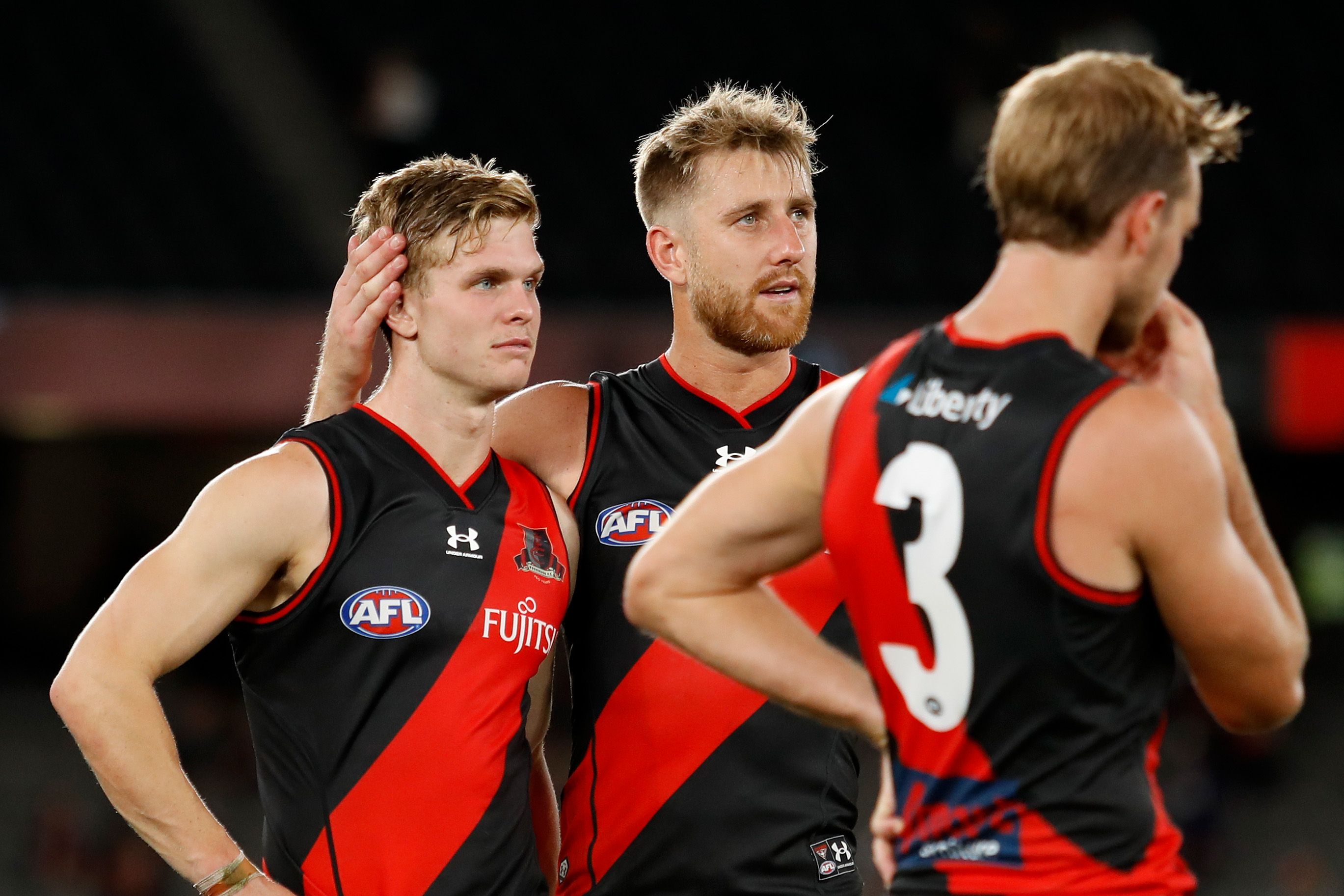 Ben Hobbs and Dyson Heppell of the Bombers look dejected after their loss to Fremantle.