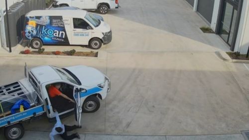 The dramatic moment a worker was pushed from his own car as he tried to stop a thief in Adelaide's north-west has been caught on camera.