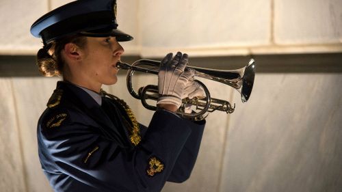 A New Zealand Defense Force bugler plays the last post at the Tomb of the Unknown Warrior during a ceremony to commemorate the centenary of World War One. (Getty)