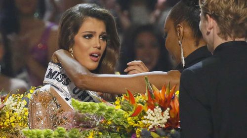 Iris Mittenaere is overcome with joy as she is crowned Miss Universe. (AAP)