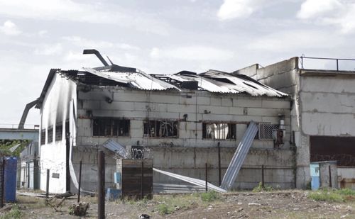 In this photo taken from video a view of a destroyed barrack at a prison in Olenivka, in an area controlled by Russian-backed separatist forces, eastern Ukraine, Friday, July 29, 2022. Russia and Ukraine accused each other Friday of shelling a prison in a separatist region of eastern Ukraine, an attack that reportedly killed dozens of Ukrainian military prisoners who were captured after the fall of a southern port city of Mariupol in May. (AP Photo)