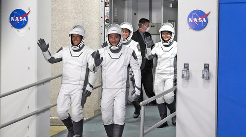 Members of the SpaceX Crew-4 mission, from left, pilot Bob Hines, commander, Kjell Lindgren, mission specialist Jessica Watkins, and mission specialist European Space Agency astronaut Samantha Cristoforetti, of Italy, leave the Operations and Checkout building for a trip to Launch Pad 39-A and a planned liftoff Wednesday, April 27, 2022, at the Kennedy Space Center in Cape Canaveral. 