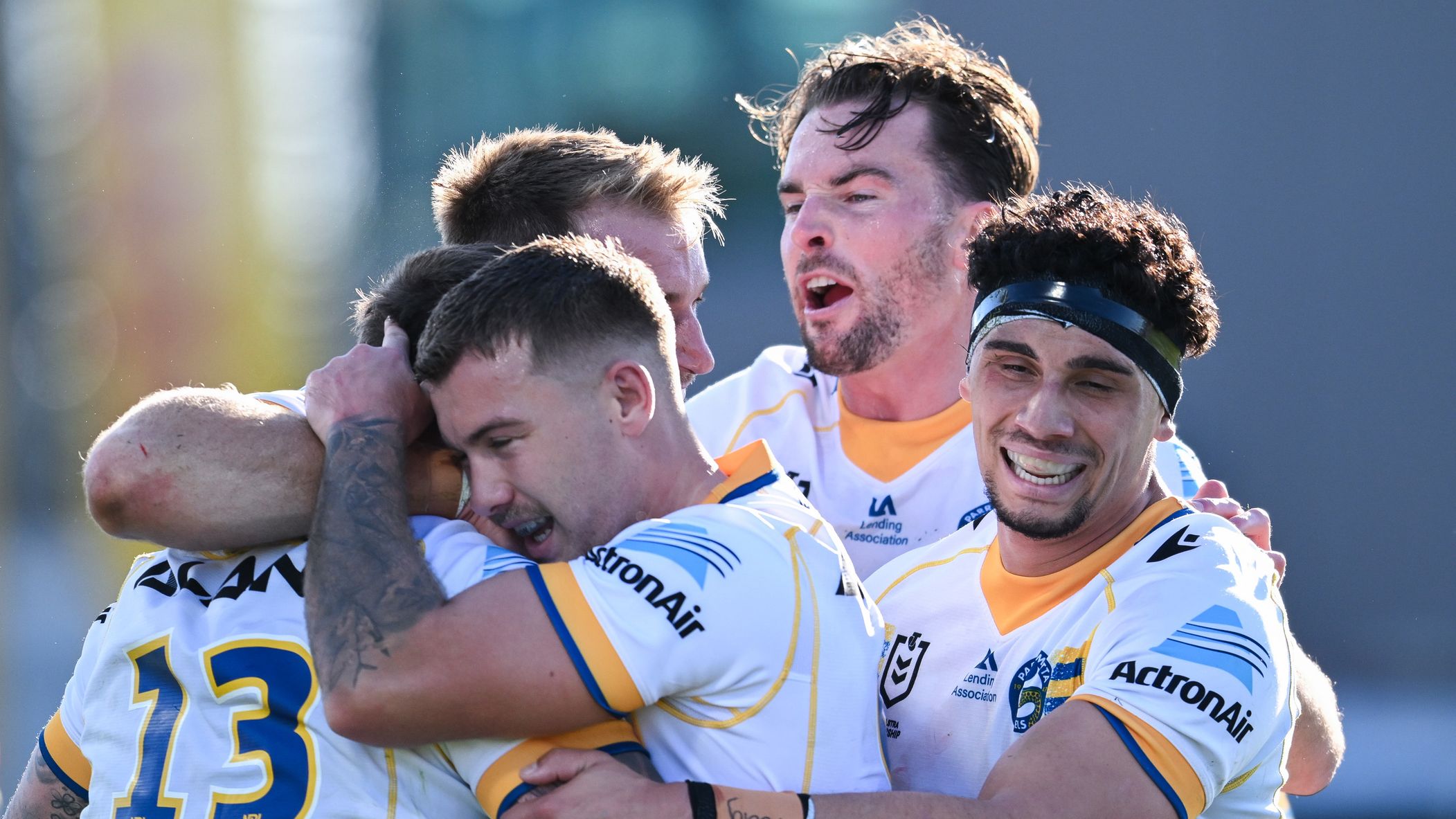 The Eels celebrating a try to J&#x27;maine Hopgood.