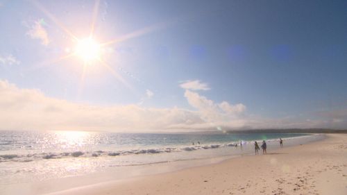 The pristine beach no longer belongs just to the locals.