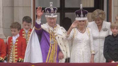 King Charles III and Queen Camilla on the balcony of Buckingham Palace following the coronation of King Charles III.