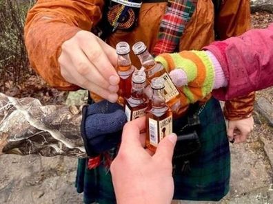 A picture of four men sharing a drink while on a bushwalk has left readers scratching their heads.