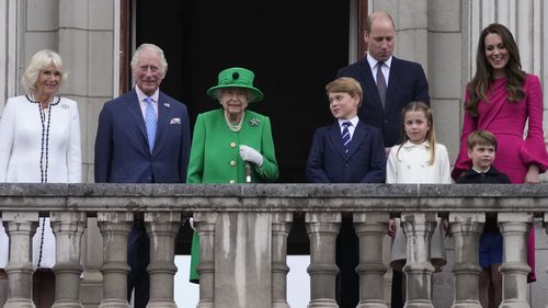 Queen Elizabeth II stands on the balcony with the Royal family during the Platinum Jubilee Pageant outside Buckingham Palace in London, Sunday, June 5, 2022, on the last of four days of celebrations to mark the Platinum Jubilee.  