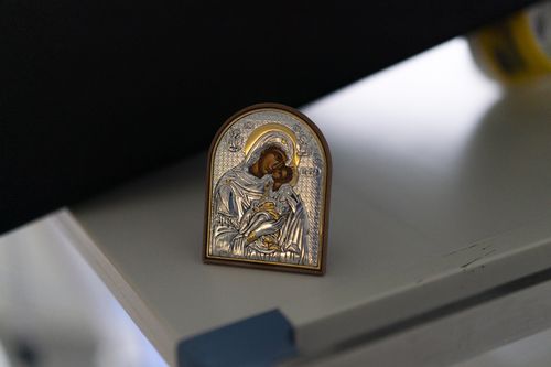 A religious item left by the family of a COVID-19 patient on a ventilator is pictured at his bedside in the COVID-19 unit at the la Timone hospital in Marseille, southern France, Thursday, Dec. 23, 2021.