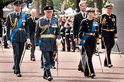 (L-R) Prince William, Prince of Wales, King Charles III, Princess Anne, Princess Royal, Prince Harry, Duke of Sussex and Sir Timothy Laurence follow the coffin of Queen Elizabeth II during a procession from Buckingham Palace to Westminster Hall during a ceremonial procession on September 14, 2022 in London, United Kingdom. 