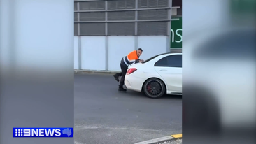 Car workshop boss clings to moving Mercedes in Melbourne car park dispute