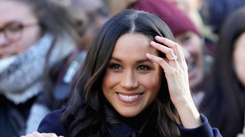 Meghan Markle showing off her engagement ring. 