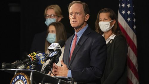 Republican US Sen. Pat Toomey, of Pennsylvania, announces he won't seek reelection or run for governor during a news conference with his family, Monday, Oct. 5, 2020 at PPL Public Media Center, in Bethlehem, Pa