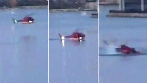 A bystander captured the moment the helicopter plunged into the water and below the surface. (Supplied)