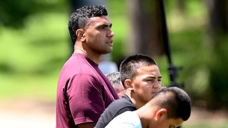 Tevita Pangai Junior watches a Broncos training session at Red Hill.