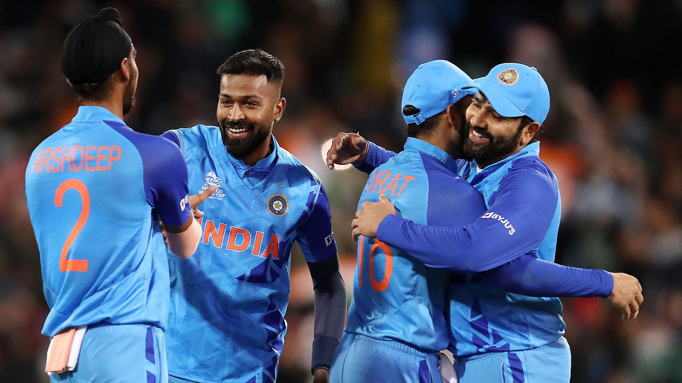 Indian players Arshdeep Singh, Hardik Pandya, Rohit Sharma and Virat Kohli celebrate the win over Bangladesh