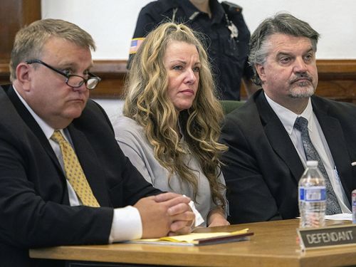 Lori Vallow Daybell sits between her attorneys for a hearing at the Fremont County Courthouse in St. Anthony, Idaho, on Aug. 16, 2022. An Idaho judge says a couple accused in a bizarre triple murder case will not be allowed to meet face-to-face to talk about strategy before they stand trial in April 2023. 