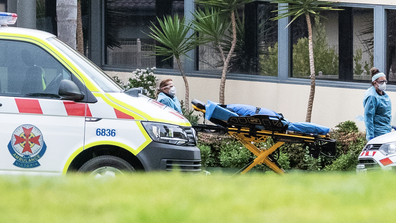 Ambulance service workers push a stretcher into the St Basil's homes for the Aged facility in Fawkner on July 27, 2020 in Melbourne, Australia. 