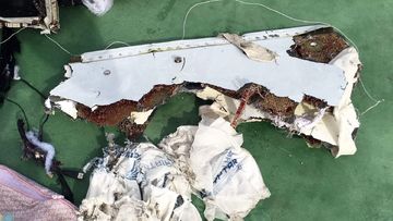 A picture uploaded on the official Facebook page of the Egyptian military spokesperson on May 21, 2016 and taken from an undisclosed location reportedly shows some debris that the search teams found in the sea after the EgyptAir Airbus A320 crashed in the Mediterranean. (AFP)