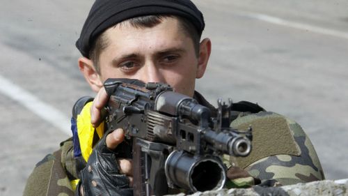 A Ukrainian soldier guards a checkpoint as tensions remain high following a ceasefire with pro-Russian forces. (Getty Images)