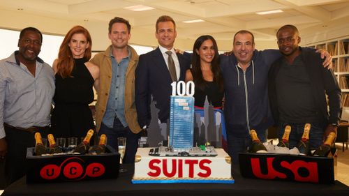 "Suits" stars Wendell Pierce, Sarah Rafferty, Patrick J. Adams, Gabriel Macht, Meghan Markle, Rick Hoffman and Dulé Hill celebrate the show's 100th episode. Picture: Getty