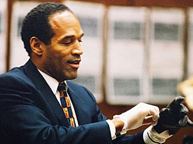 OJ Simpson putting on glove (Getty)