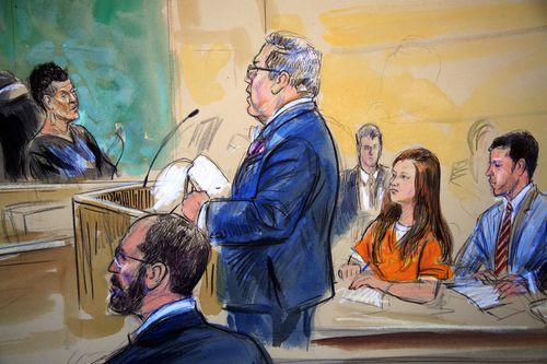 This courtroom sketch depicts Maria Butina, in orange suit, a 29-year-old gun-rights activist suspected of being a covert Russian agent, listening to her attorney Robert Driscoll, standing, as he speaks to Judge Deborah Robinson, left, during a hearing in federal court in Washington, Wednesday, July 18, 2018. Assistant U.S. Attorney Erik Kenerson, bottom left, and co-defense attorney's Alfred Carry, right, listen. Prosecutors say Butina was likely in contact with Kremlin operatives while living in the United States. And prosecutors also are accusing her of using sex and deception to forge influential connections. (Dana Verkouteren via AP)