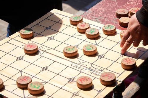 Xiangqi board with some pieces on it.