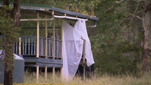 The support worker's body was found on the back deck of a home in Buccan about 3am yesterday.