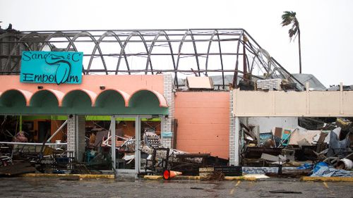 Strong winds have caused significant structural damage to buildings. (AP)