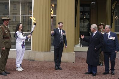 King Charles III, third right, attends the start of the Australian Legacy Torch Relay to mark the beginning of the London-leg of the charity's relay race in celebration of their centenary year at Buckingham Palace in London, Friday April 28, 2023.  