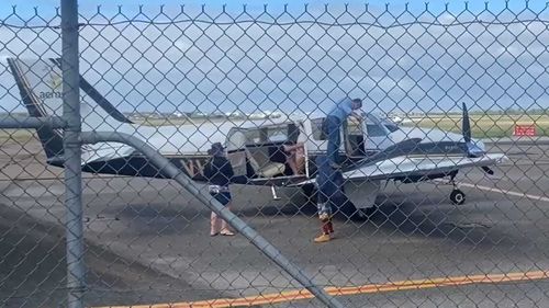 The Tobias family touch down in Adelaide after three weeks stranded in the SA outback.