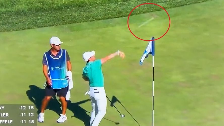 Rory McIlroy hurls a fan&#x27;s remote control golf ball into a lake out of anger.