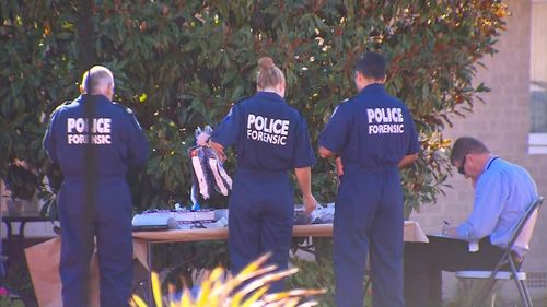 Forensic police at the Balga unit block today.