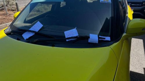 Car in Cottesloe, Perth, left plastered with notes.