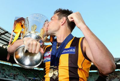 Sweet kiss: Hodge gets up close and personal with the premiership cup.