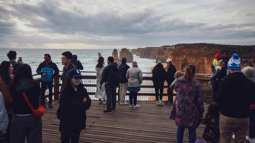 Visitors at Victoria's scenic coastline at Port Campbell. The popular tourist spot is slowly eroding over the years where visitors come to see the 12 Apostles.