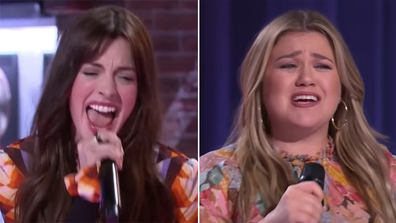 Kelly Clarkson collapses from embarrassment during singing competition with Anne Hathaway.
