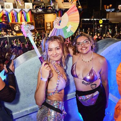 Emma Horn and Meissa Mason on the Meta float at Mardi Gras 2023.