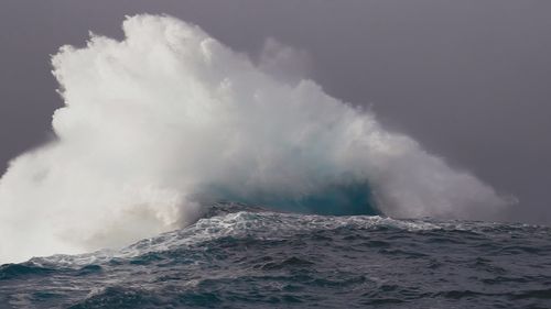 The ocean phenomenon depicts two separate swells smash against each other and spout several metres into the air.