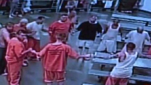 Inmates were seen on surveillance footage linking hands to create a prayer circle in a bid to comfort Douglas Edmisten in his final hours. 