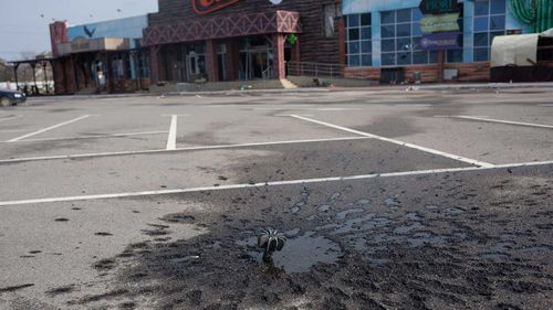 An unexploded mine in a shopping centre car park in Stoyanka, Ukraine.