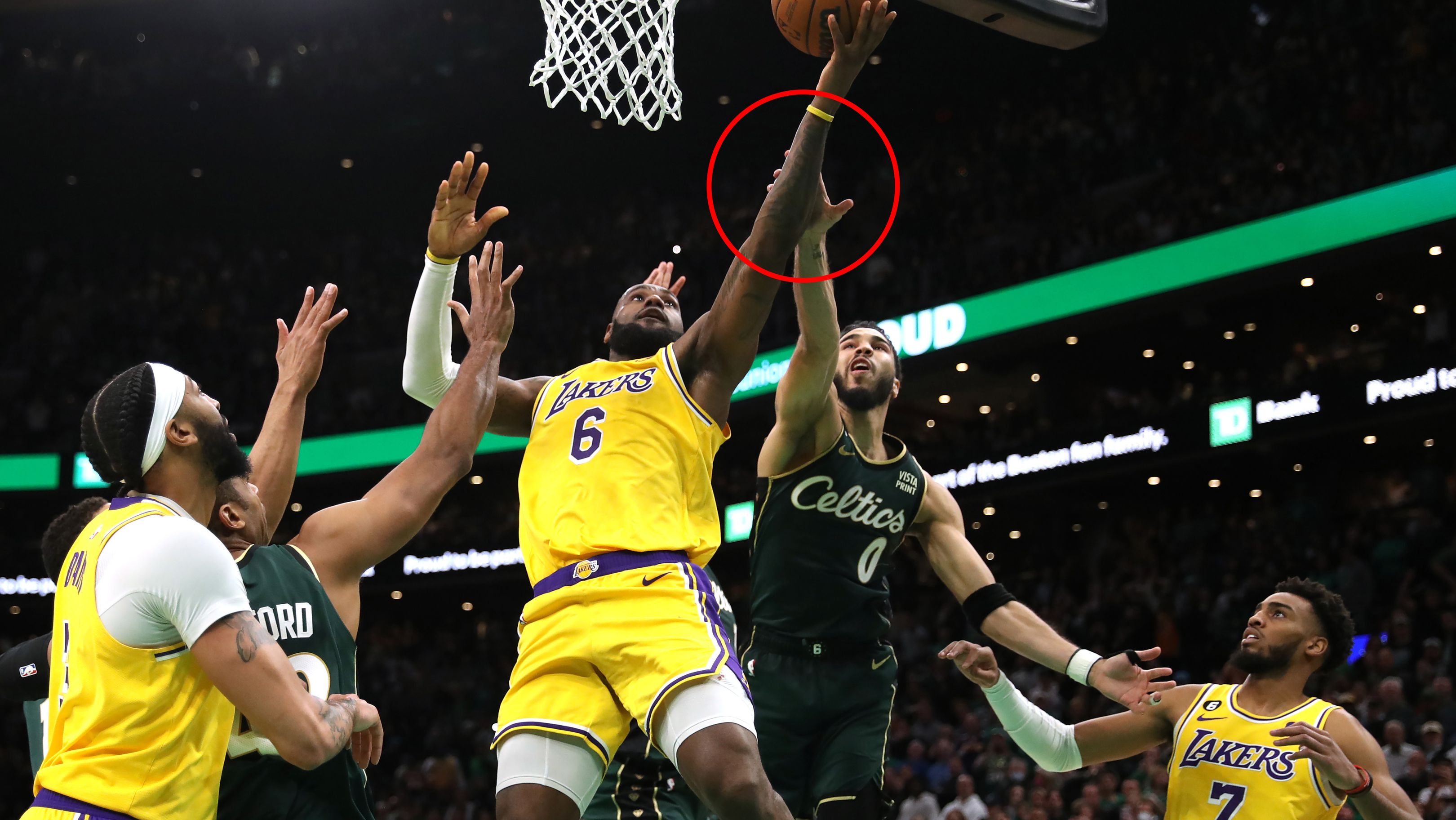 Celtics player Jayson Tatum grabs Lakers star LeBron James&#x27; arm in the final shot of regulation play during the fourth quarter at TD Garden.