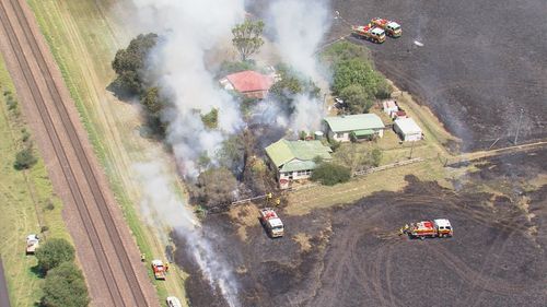 A large grassfire is burning on the edge of Sydney,﻿ with residents warned to stay updated.The fire has burned through bush around Menangle Road, near Menangle in Wollondilly﻿, with waterbombing aircraft called in.