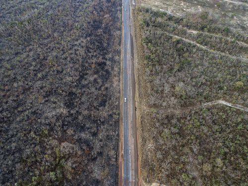 An aerial view of an area of land that has been scorched by fire in the state of Mato Grosso, Brazil, 20 August 2019. EPA/ROGERIO FLORENTINO
