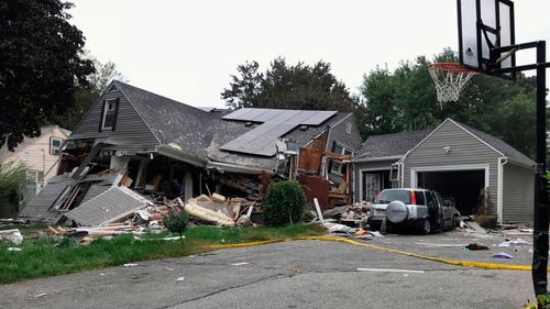 A house is destroyed in Lawrence after a series of gas explosions in the area.