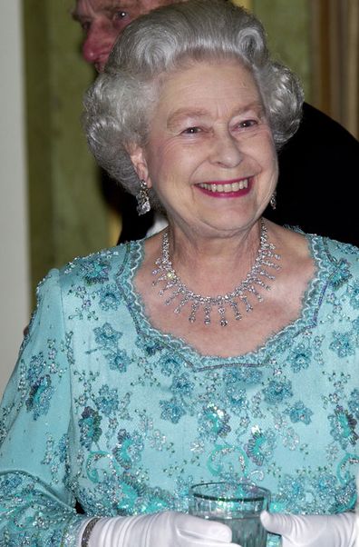 The Queen At The Dorchester Hotel Holding A Glass Before A Dinner Hosted By The President Of Poland During His State Visit To Britain (Photo: May, 2004)