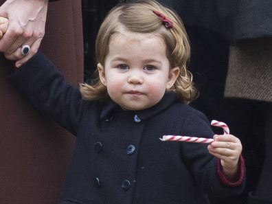 Princess Charlotte enjoys a candy cane 