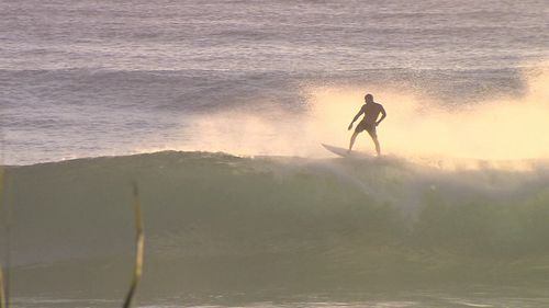 Mick Fanning was spotted surfing at Burleigh Heads this morning. (9NEWS)