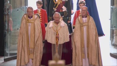 Prince George walked behind King Charles as he arrived at his coronation on May 6.