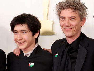 HOLLYWOOD, CALIFORNIA - MARCH 10: (L-R) Milo Machado-Graner and Swann Arlaud attends the 96th Annual Academy Awards on March 10, 2024 in Hollywood, California. (Photo by Mike Coppola/Getty Images)